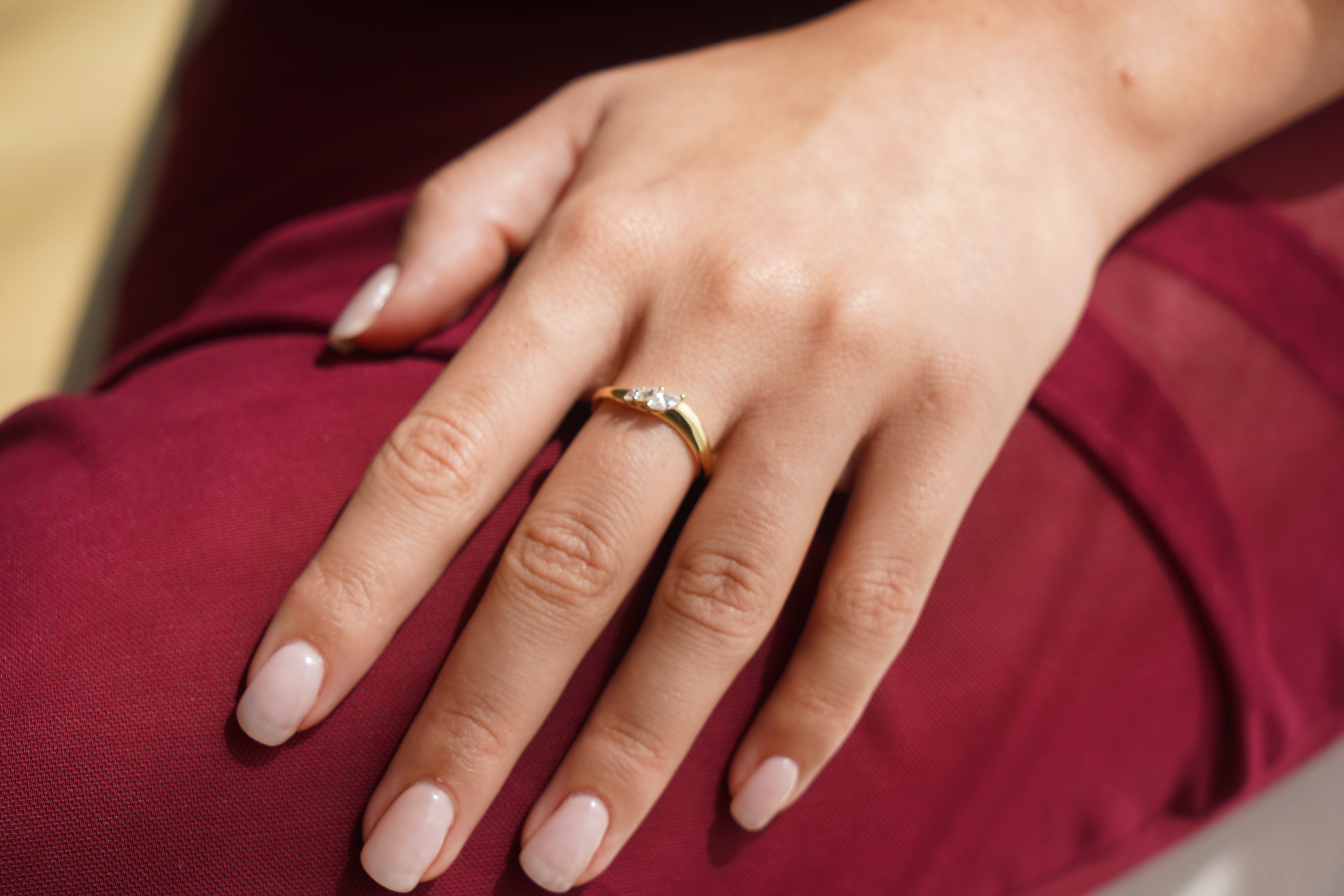Gold ring with a wave and crystals