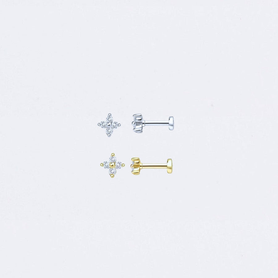 Pair of clover
star-shaped earrings on a light gray background