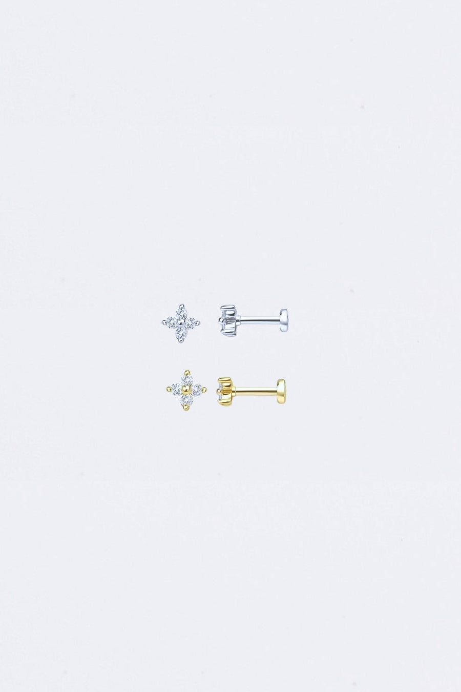 Pair of clover
star-shaped earrings on a light gray background