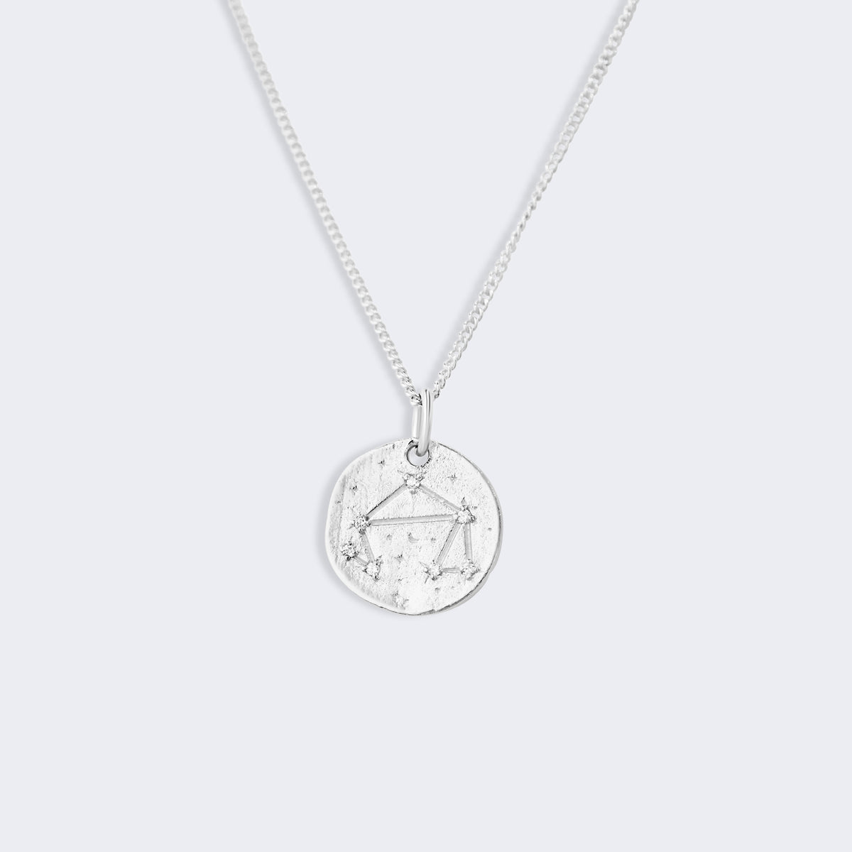 Libra star constellation necklace on a fine curb chain, pendant showing the Libra constellation set with small zircons