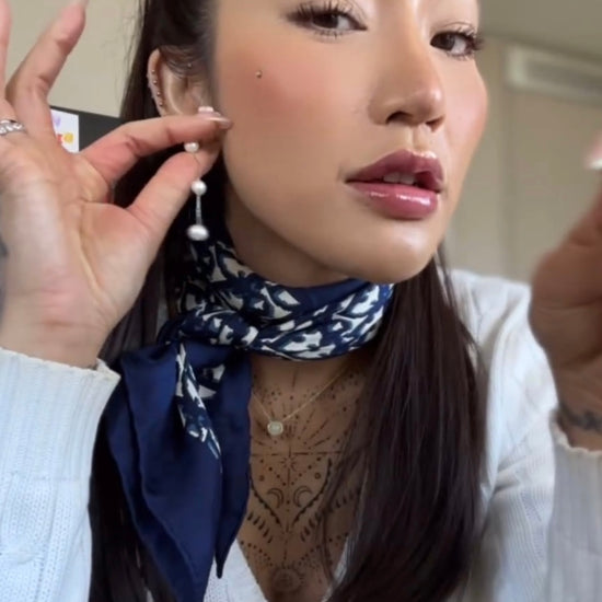 girl wearing 3 tier pearl earrings luxury jewellery 