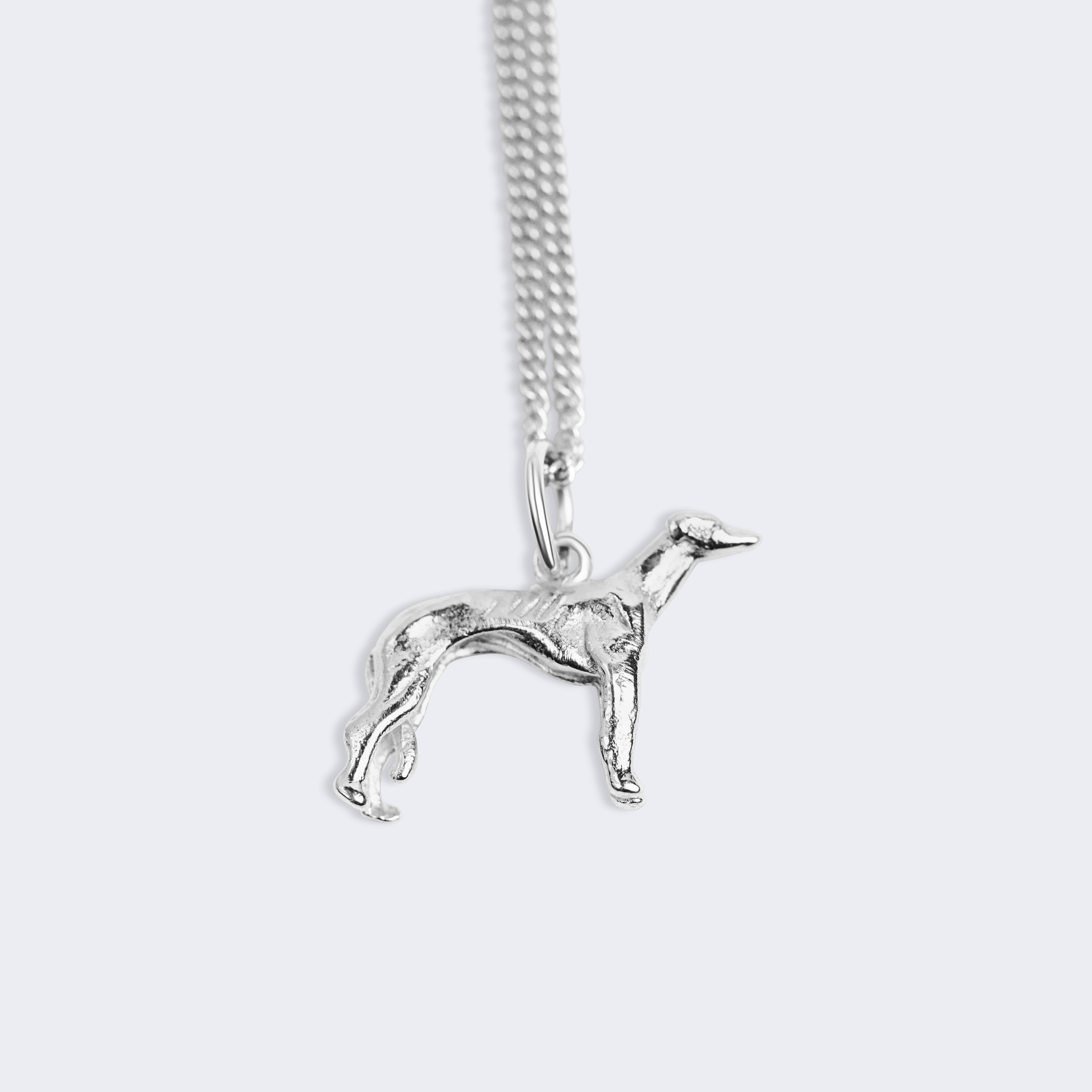 A silver-tone Italian Greyhound dog pendant necklace on a matching chain, shown against a light gray background.